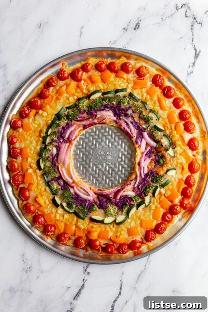 Close-up of the Rainbow Pizza toppings, showcasing the vivid colors and fresh vegetables.