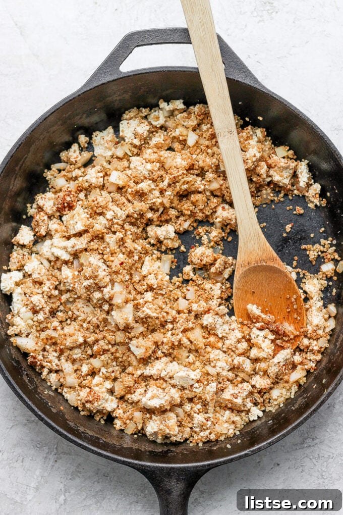 Zesty Quinoa Tofu Taco Crumbles 5 The skillet proudly displaying the rich, savory cooked quinoa and crumbled tofu taco 'meat', perfectly seasoned and heated through, ready to be served or added to your favorite taco creation.