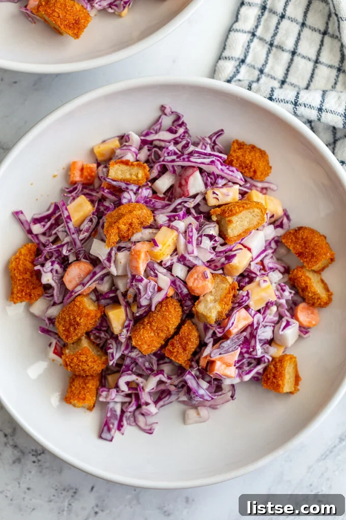 A beautifully presented Cabbage Salad, vibrant with purple cabbage and other fresh ingredients, ready to be enjoyed.