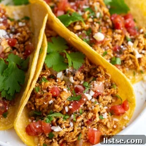 Crispy Tofu Tacos 7 shredded tofu tacos made with corn tortillas and topped with cotija cheese, chopped cilantro, and diced tomatoes