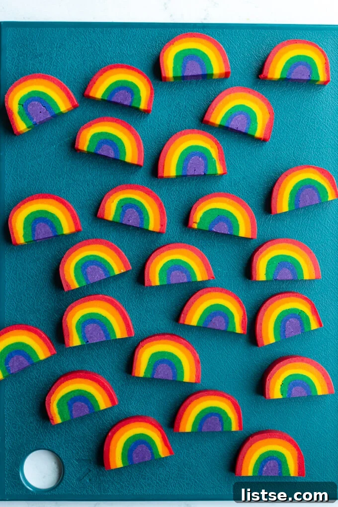 Kaleidoscope Cookies 6 A pair of vibrant rainbow cookies, perfectly arched and ready to be enjoyed.