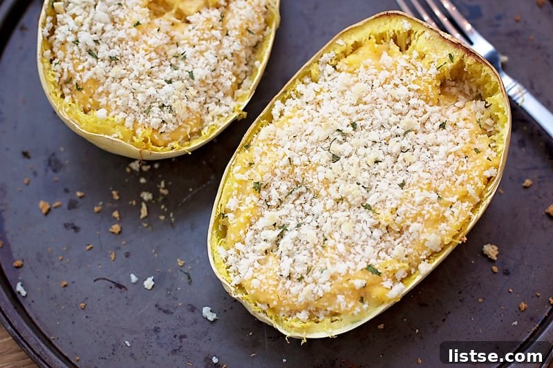 Freshly baked Twice Baked Spaghetti Squash Mac n' Cheese, golden and bubbling, straight from the oven.
