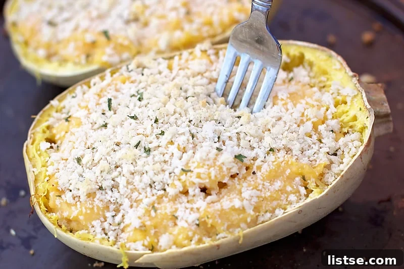 An appetizing serving of Twice Baked Spaghetti Squash Mac n' Cheese, ready to be enjoyed.
