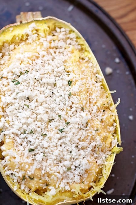 Close-up of the cheesy, golden-brown topping on Twice Baked Spaghetti Squash Mac n' Cheese, showcasing its irresistible texture.