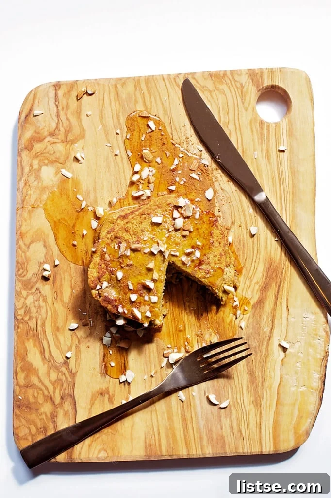 Spiced Pumpkin Protein Stacks 15 Close-up of a Pumpkin Protein Pancake with Maple Syrup