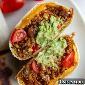 shredded tofu burritos filled with cheese, tomato and quacamole
