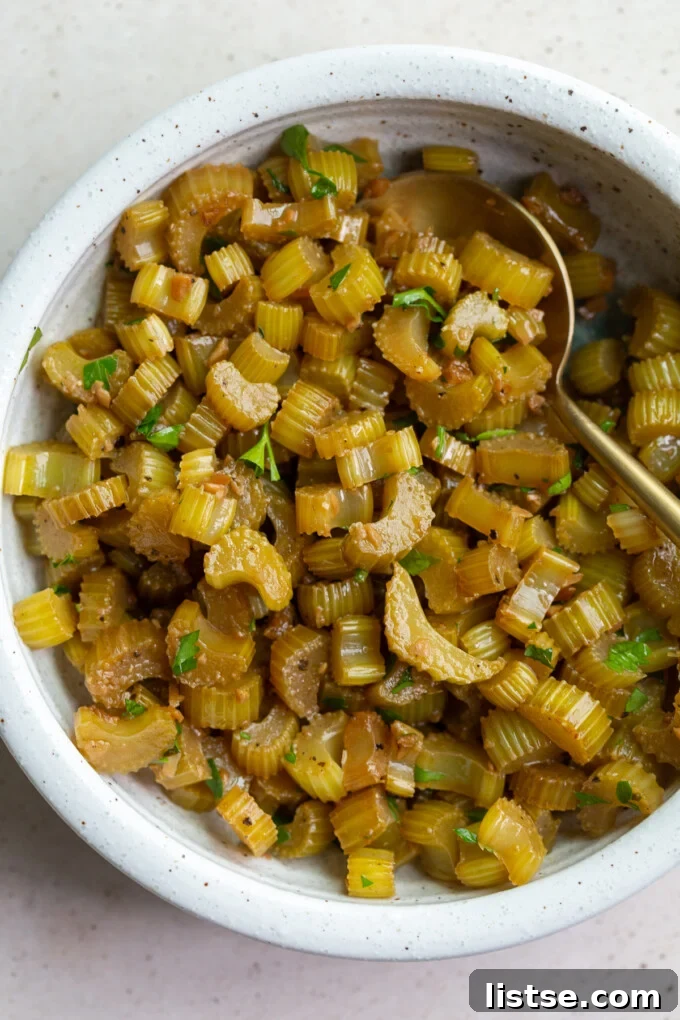 Perfectly sautéed garlic celery in a skillet, showcasing its tender texture.