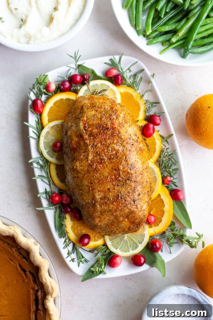 Feast Without Fowl 2 A beautifully roasted vegan turkey loaf garnished with fresh herbs and vibrant citrus slices, surrounded by classic holiday side dishes like green beans, pumpkin pie, and creamy mashed potatoes.