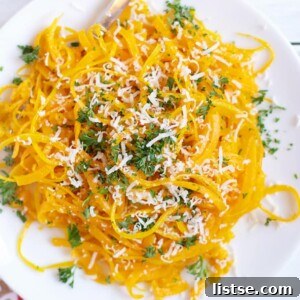 A dish of Butternut Squash Pasta with fresh herbs.