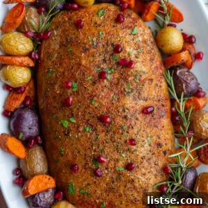 Stuffed Vegan Holiday Roast 12 A vibrant platter featuring a golden-brown stuffed vegan turkey roast, surrounded by an assortment of perfectly roasted vegetables, showcasing its crispy skin.
