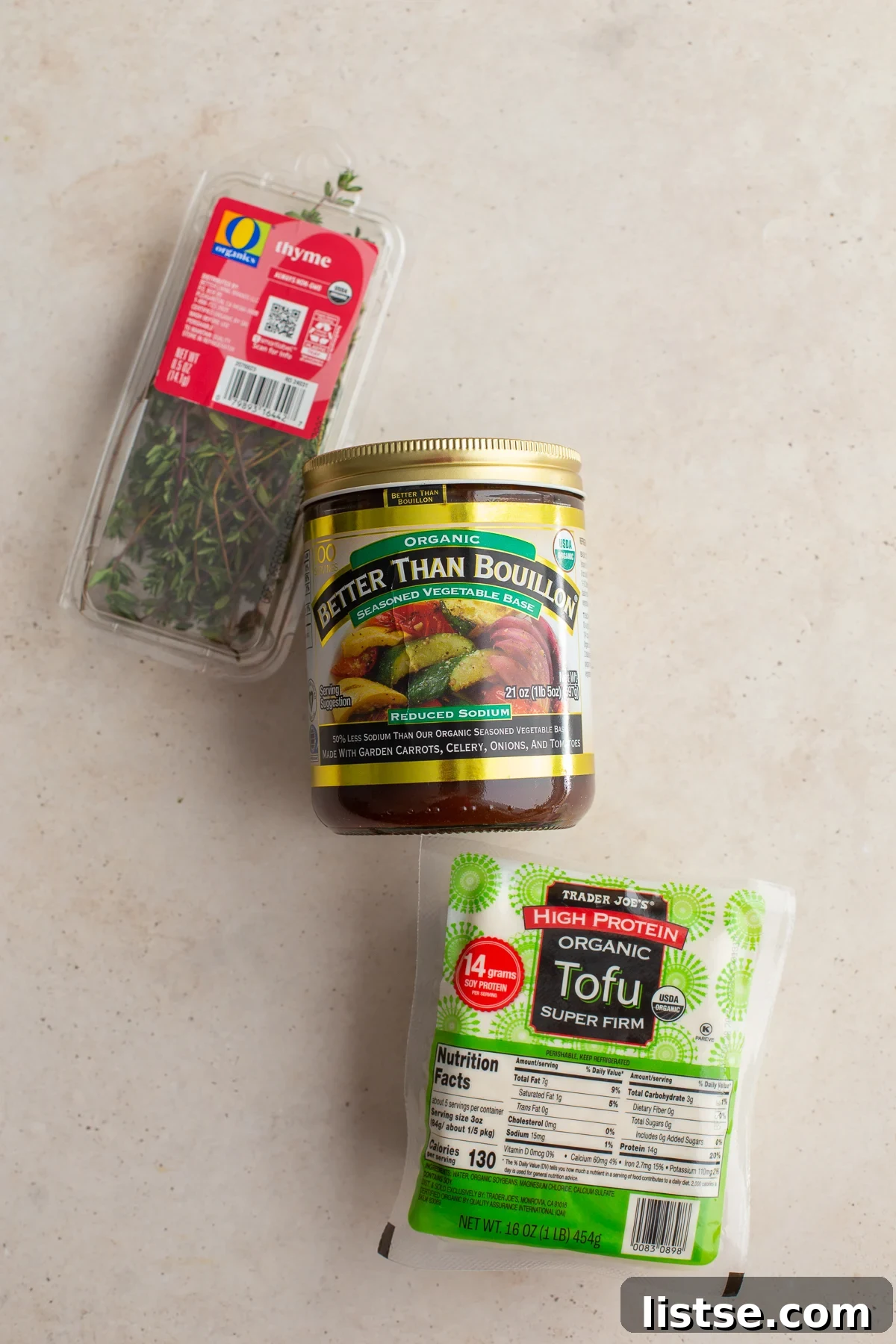 Tofu Lunch: Mock Meat Magic 4 A selection of ingredients for Tofu Lunch Meat, including a block of tofu, bouillon, herbs, and pepper