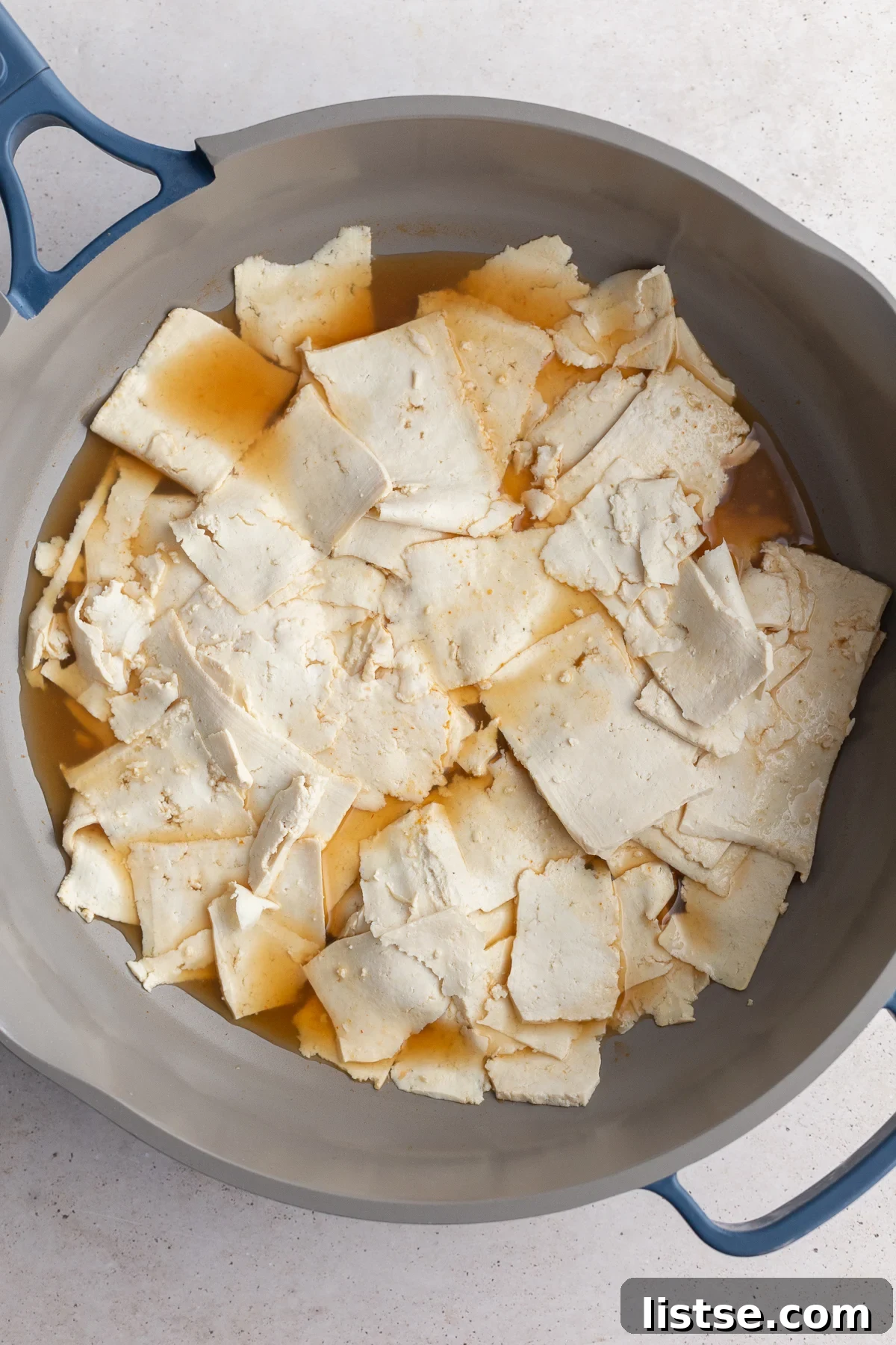 Tofu Lunch: Mock Meat Magic 6 Step 2: Tofu strips simmering in a pan with herb-infused vegetable broth