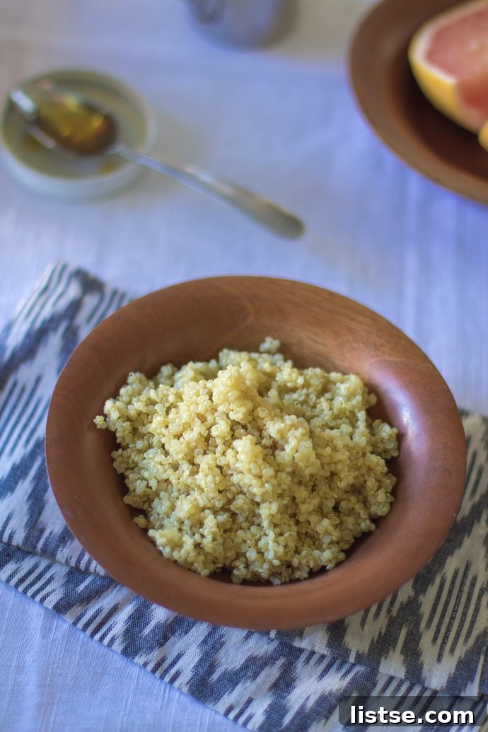 Pouring milk over quinoa in a bowl