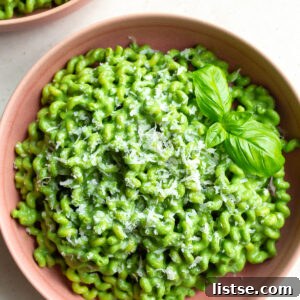 Emerald Goddess Pasta Delight 6 Green goddess pasta served in a pink bowl.