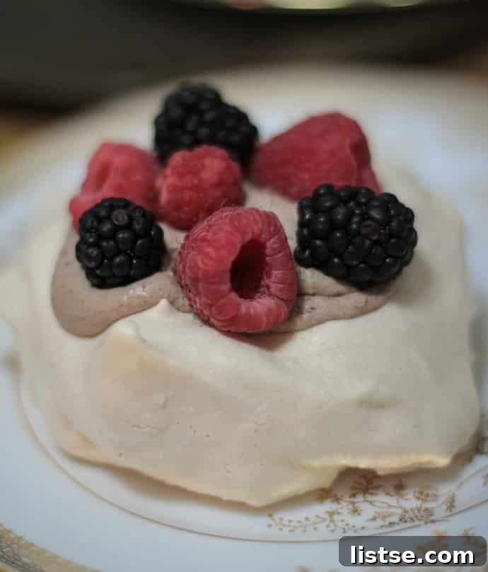 Evening in Bloom 19 Individual Pavlovas with chocolate whipped cream and fresh berries, a delightful spring dessert.