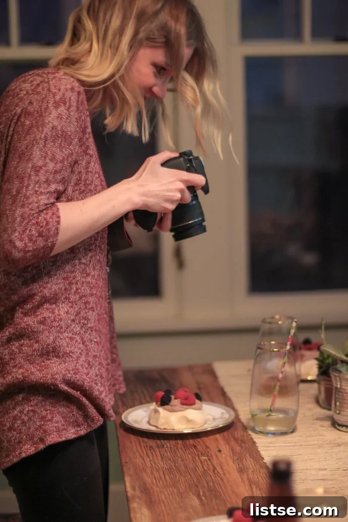 Evening in Bloom 6 Close-up of a food blogger expertly capturing a shot of the beautifully presented spring dishes.