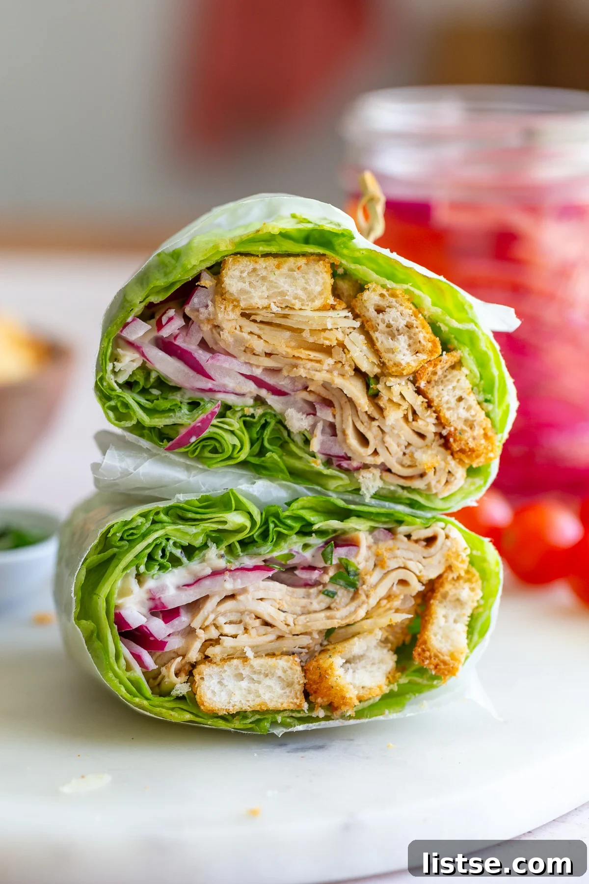 Delicious Caesar Tofu Lettuce Wraps arranged beautifully on a plate, ready to be enjoyed.