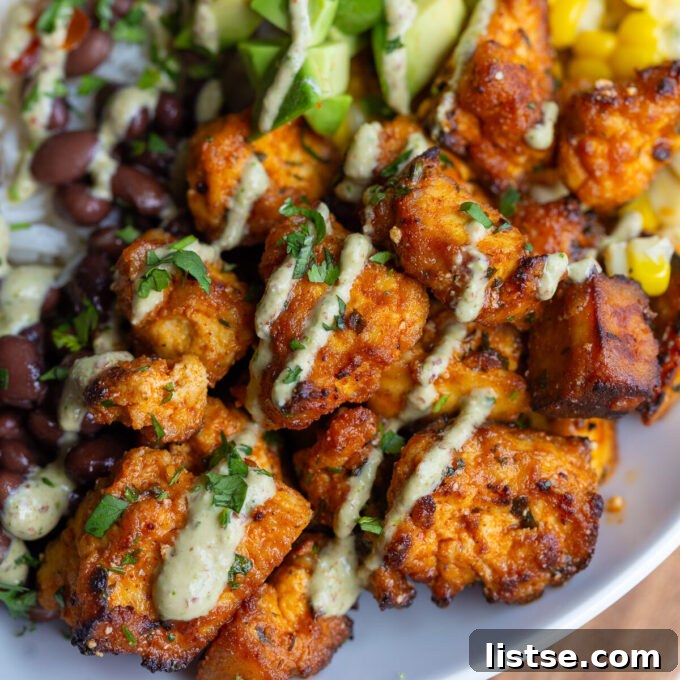 Summer Tofu Transformed: 3 Amazing Marinades 6 Cooked cilantro lime tofu served in a bowl with fresh herbs