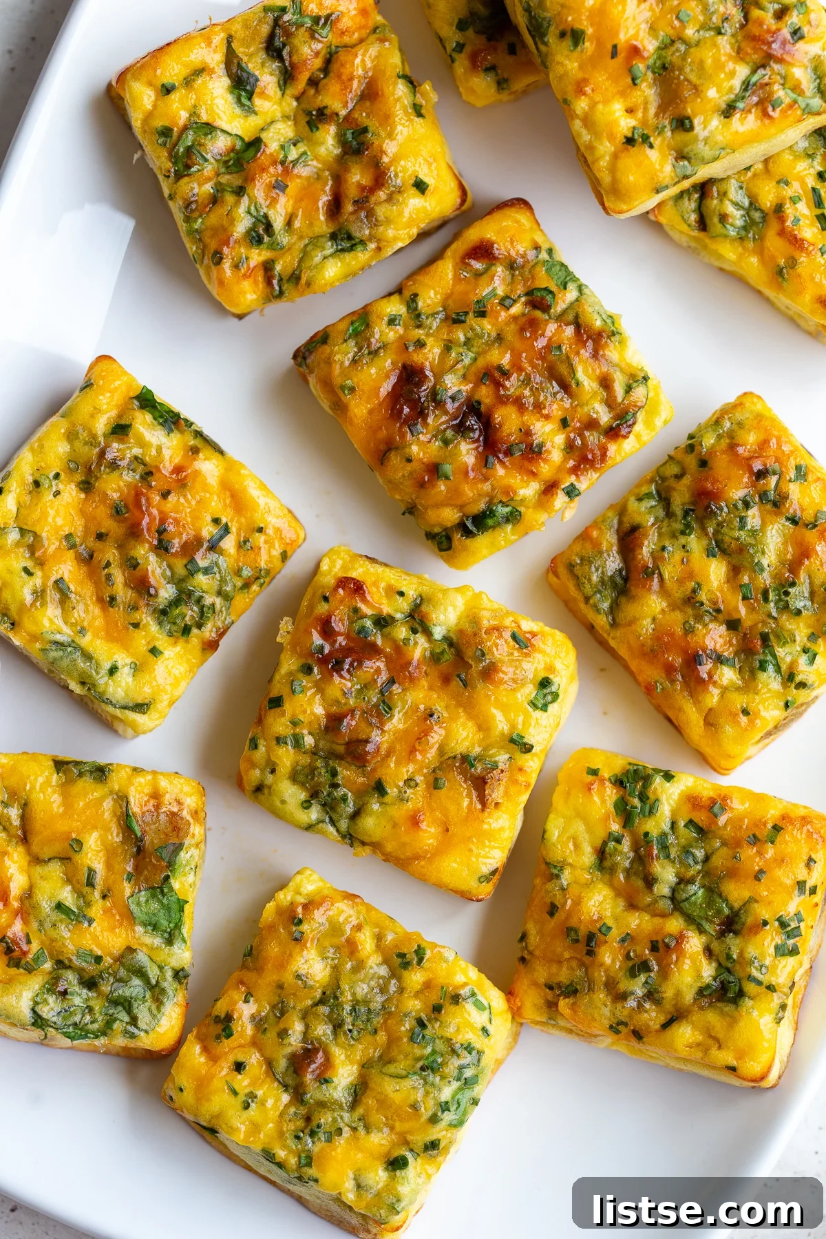 Beautifully arranged potato and chive egg bites, showcasing the texture and fresh ingredients.