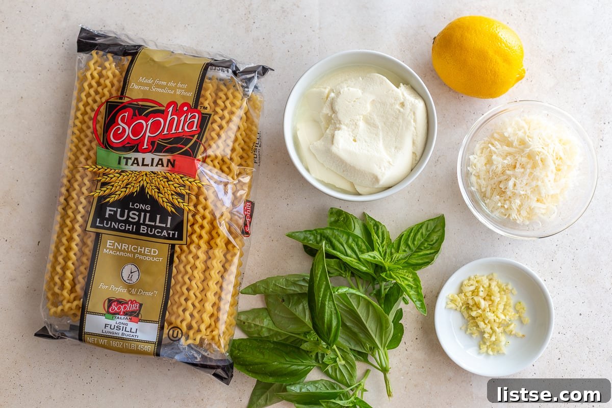 ingredients needed to make ricotta pasta including pasta, basil, ricotta, lemon, parmesan, and garlic