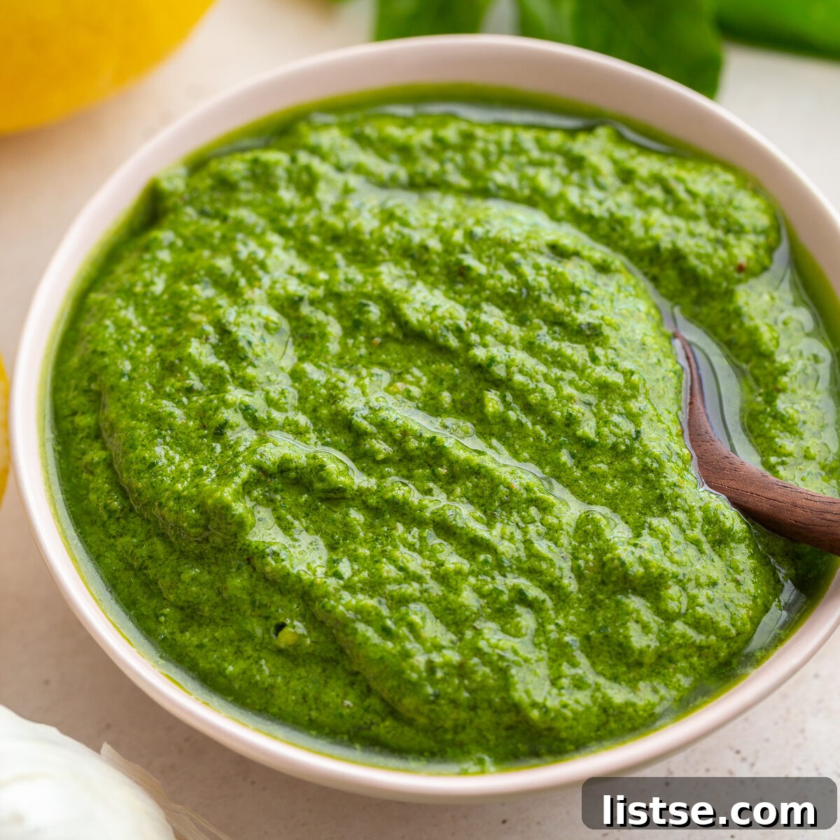 Crafting Perfect Homemade Basil Pesto 5 A vibrant bowl of freshly made basil pesto ready to be enjoyed.