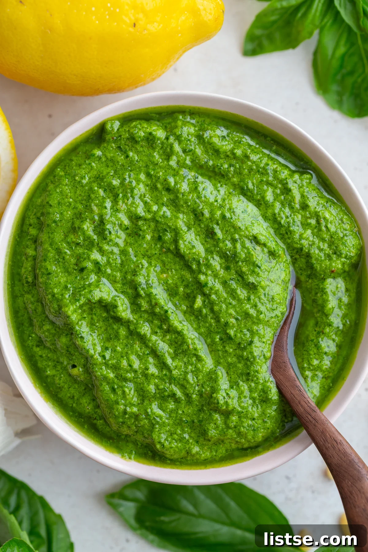 Crafting Perfect Homemade Basil Pesto 10 Close-up shot of traditional homemade pesto in a bowl.