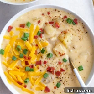 Rich and creamy slow cooker potato soup, garnished with green onions.