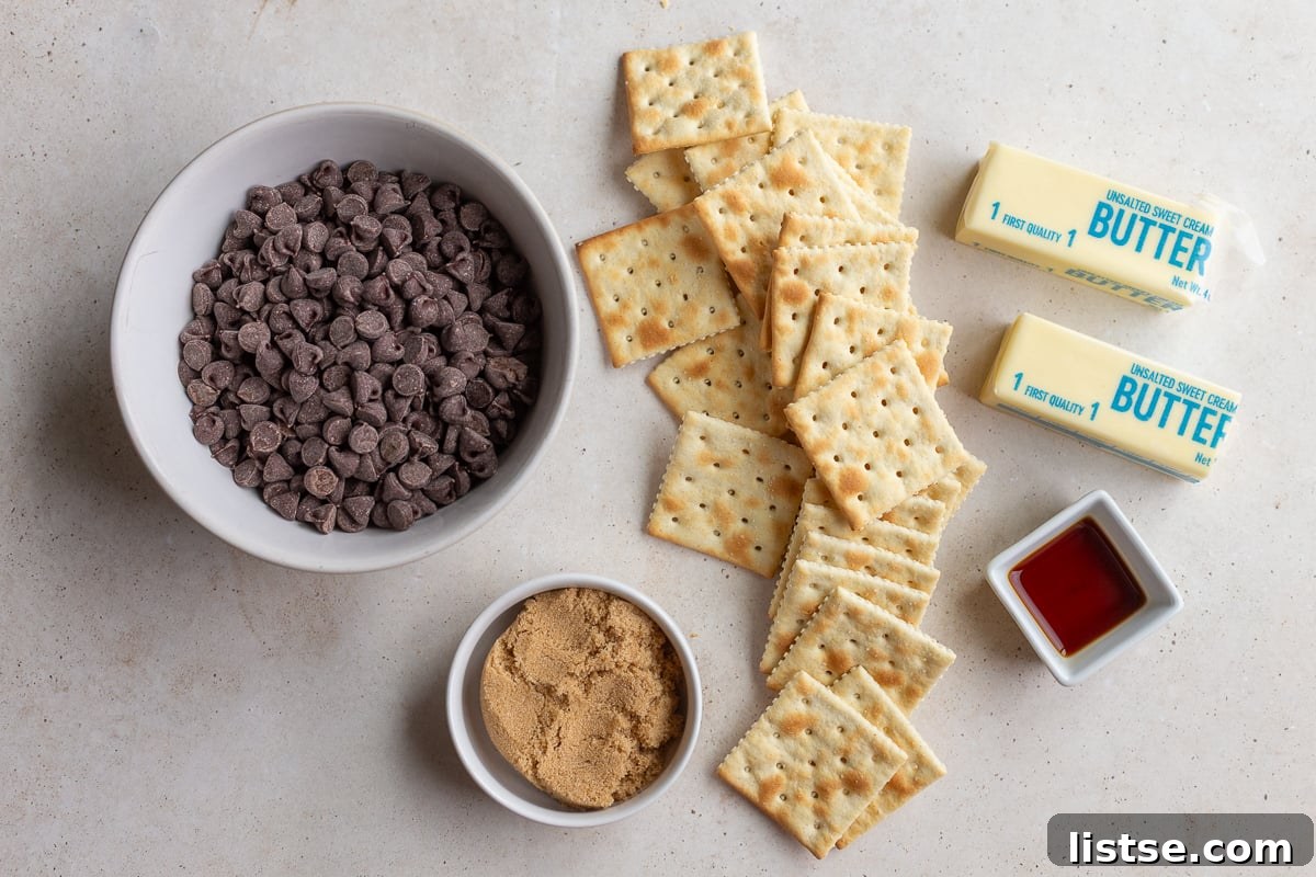 ingredients needed to make christmas crack including saltine crackers, chocolate chips, brown sugar, and butter