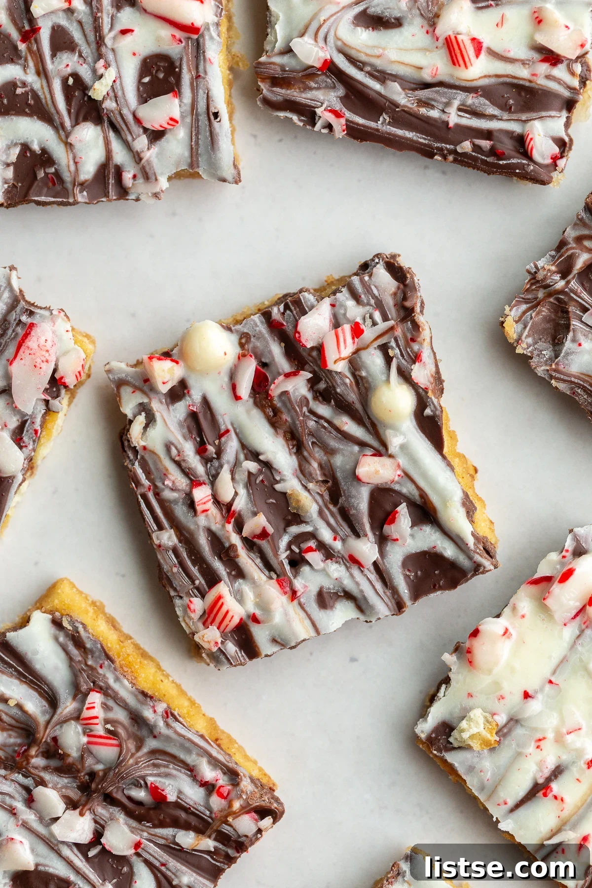 christmas cracker candy topped with white chocolate and crushed peppermint