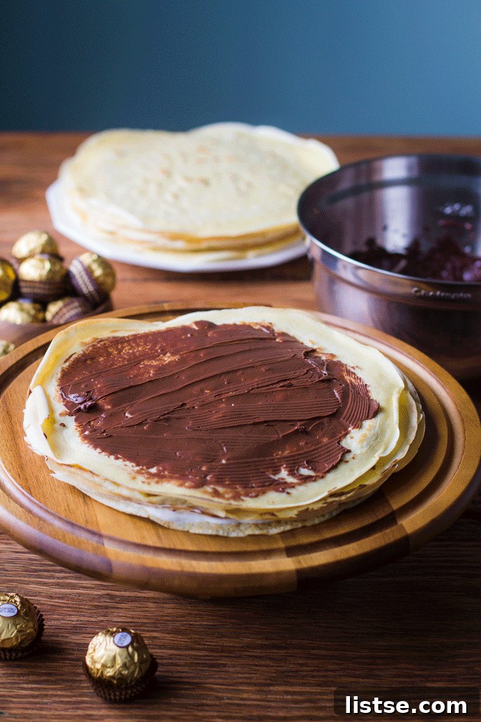 Animated image showing the process of layering a crepe cake