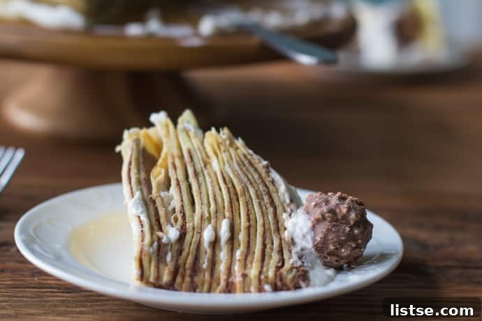 Close-up of a slice of crepe cake revealing its delicate layers