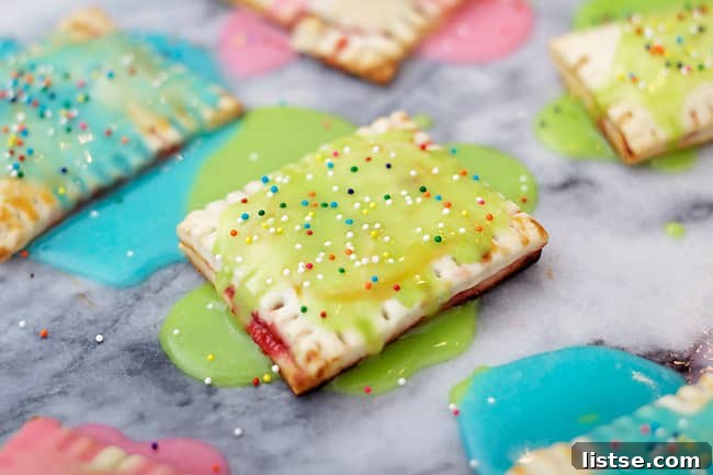 Applying glaze to homemade strawberry pop tarts