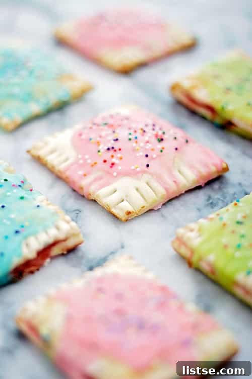 Finished homemade strawberry pop tarts with sprinkles