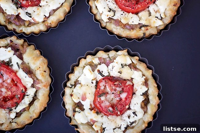 Goat Cheese and Thyme Tarts Close-up of a perfectly baked goat cheese and tomato tart