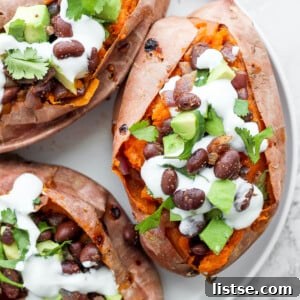 sweet potatoes stuffed with black beans, and avocado and topped with crema