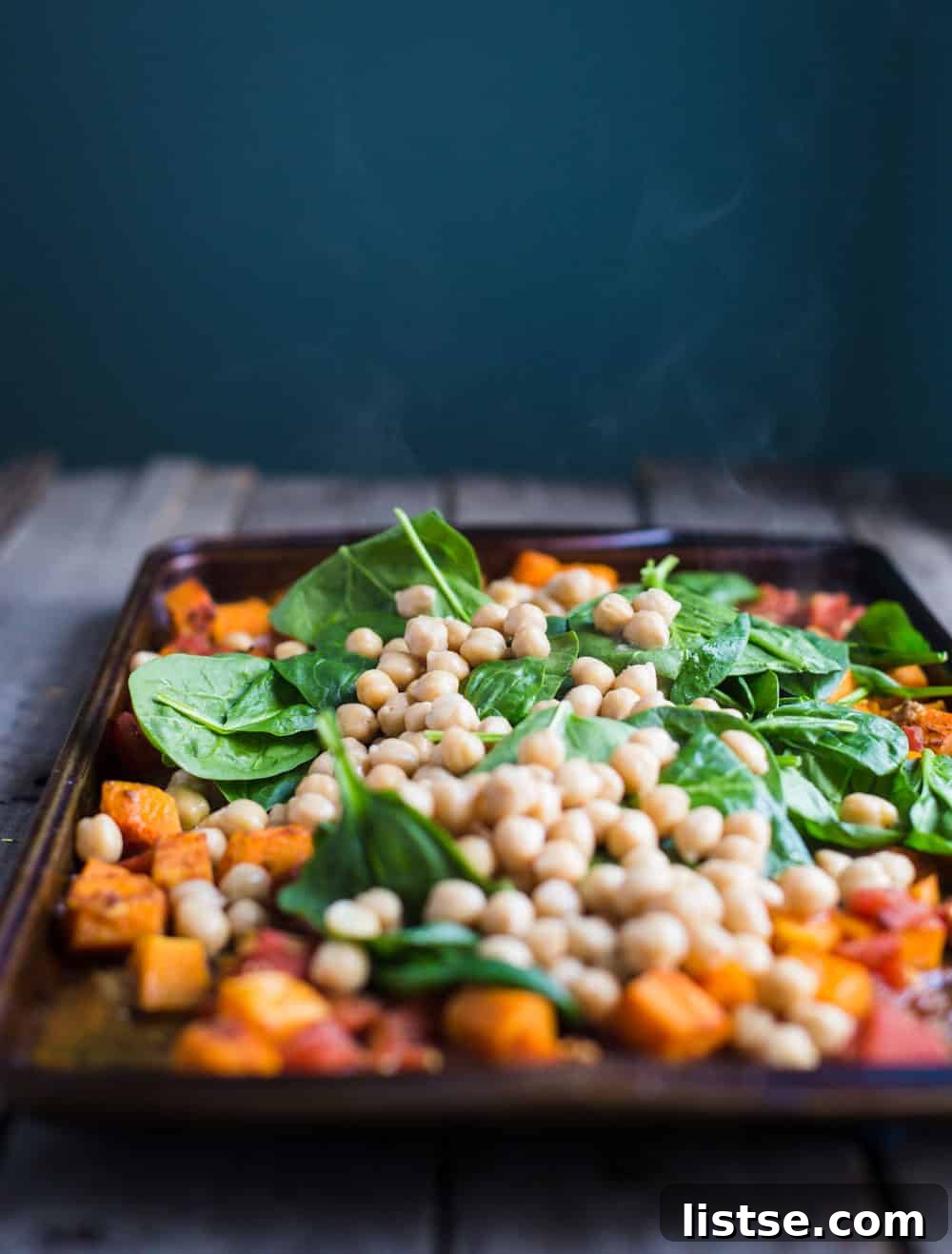 One Pan Salmon and Squash with Couscous- this recipe is made with a delicious Moroccan spice blend and is SO easy to throw together for dinner!