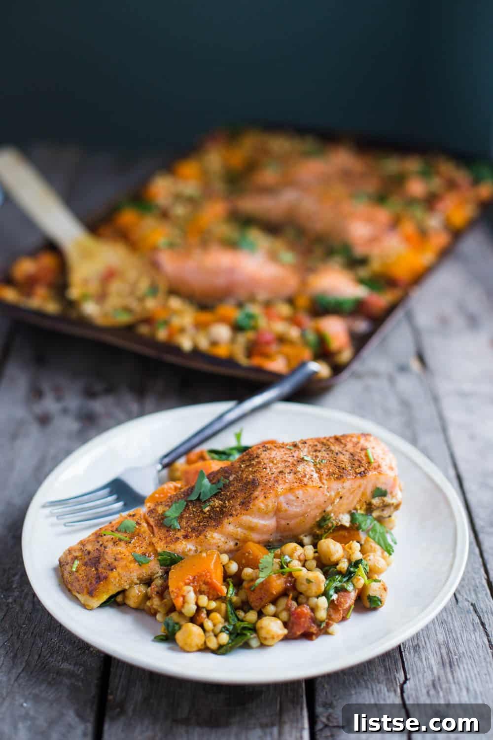 One Pan Salmon and Squash with Couscous- this recipe is made with a delicious Moroccan spice blend and is SO easy to throw together for dinner!