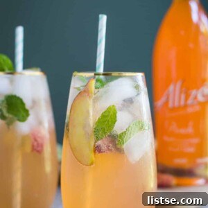 Beautifully garnished Peach Mojito ready for serving.
