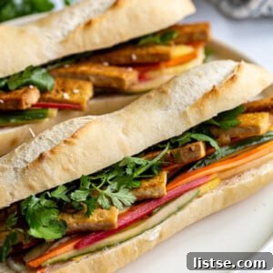 Tofu Banh Mi sandwich on a white plate.