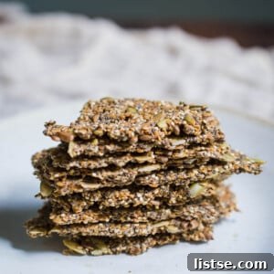 Crispy Super Seed Crackers with a green dip.