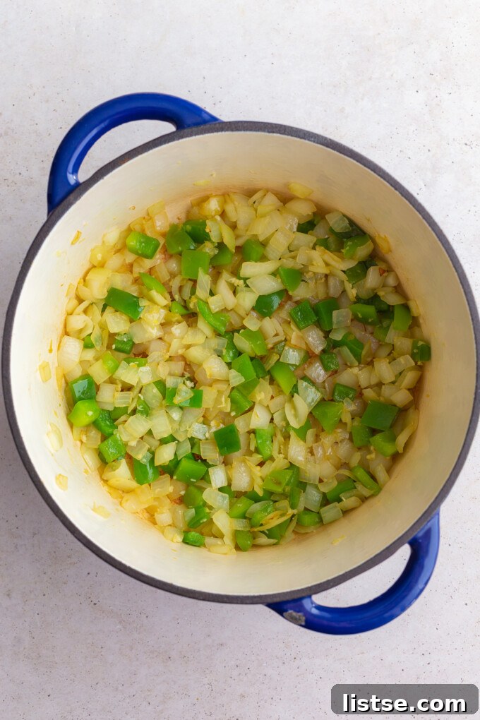Ultimate Plant-Based Chili 5 First step in making veggie chili: gently sautéing the chopped onions and bell peppers in olive oil in a large pot until tender and fragrant.