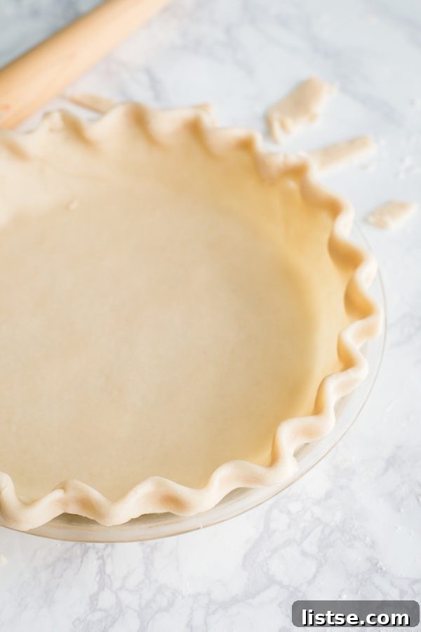 The golden-brown, finished coconut oil vegan pie crust, glistening slightly and perfectly ready for your favorite filling