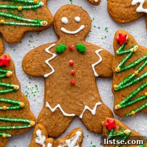 vegan gingerbread cookies cut into shapes and decorated with icing