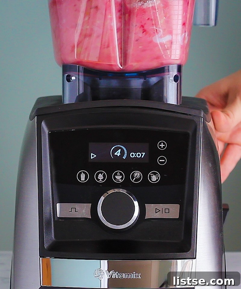High-speed Vitamix Ascent Series Blender crafting the smooth and creamy raspberry filling for a vegan tart