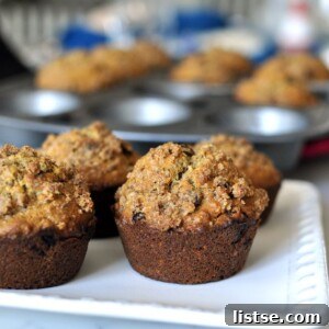 Healthy Cinnamon Raisin Lactation Muffins on a cooling rack.