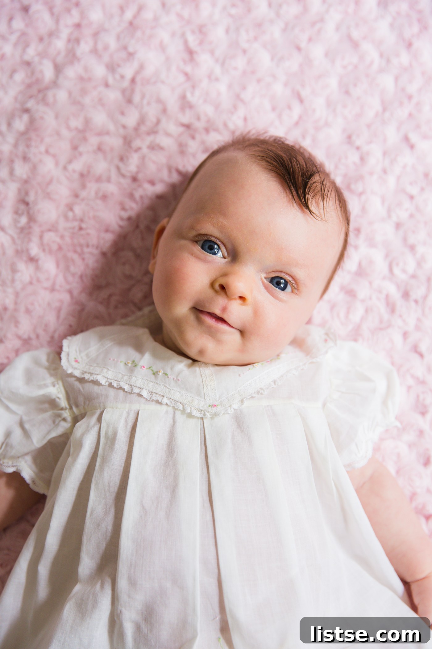 Jemma, 2 months old, wearing a vintage family dress.