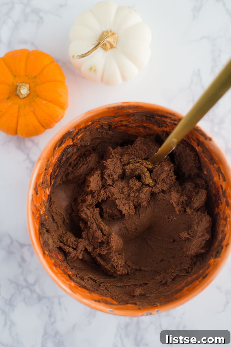 A batch of Dark Chocolate Pumpkin Truffles waiting to be rolled.