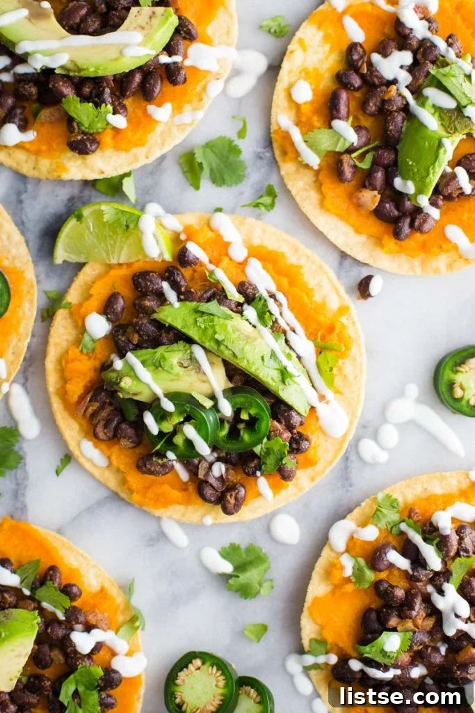 Vibrant Sweet Potato and Black Bean Tostadas 4 A sweet potato and black bean tostada ready to be served, showcasing vibrant colors and toppings