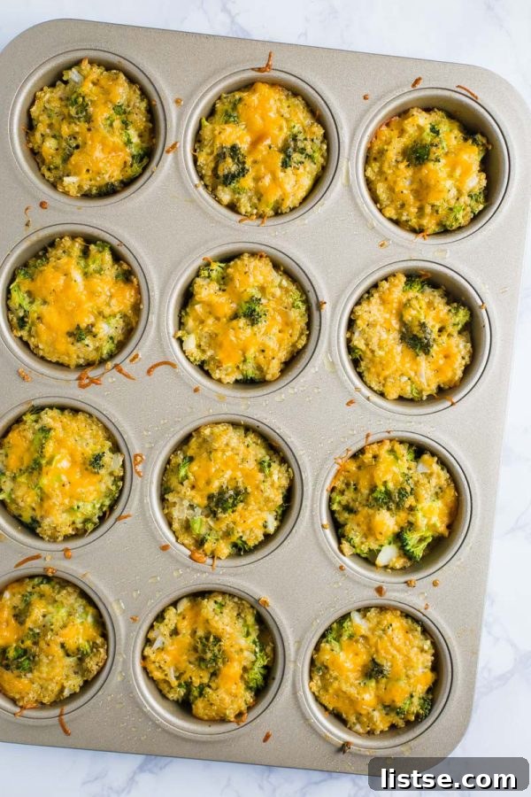 quinoa, cheddar cheese, and broccoli bites in a muffin tin on a marble board