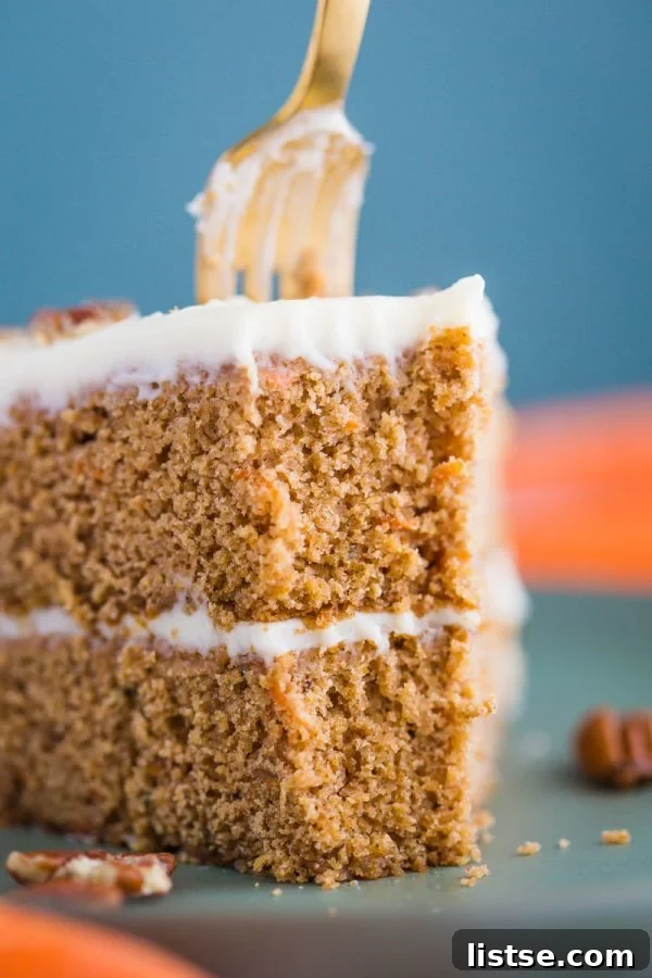 My Mother-In-Law's Foolproof Carrot Cake 4 Homemade carrot cake layers cooling on a wire rack, ready for frosting, emphasizing the freshness and homemade quality.